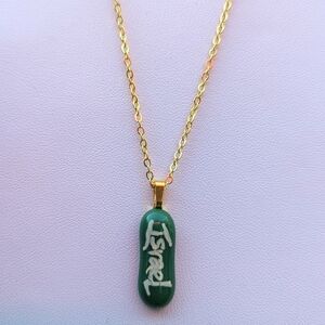 Hand crafted artisan made green glass Israel support handwritten necklace.